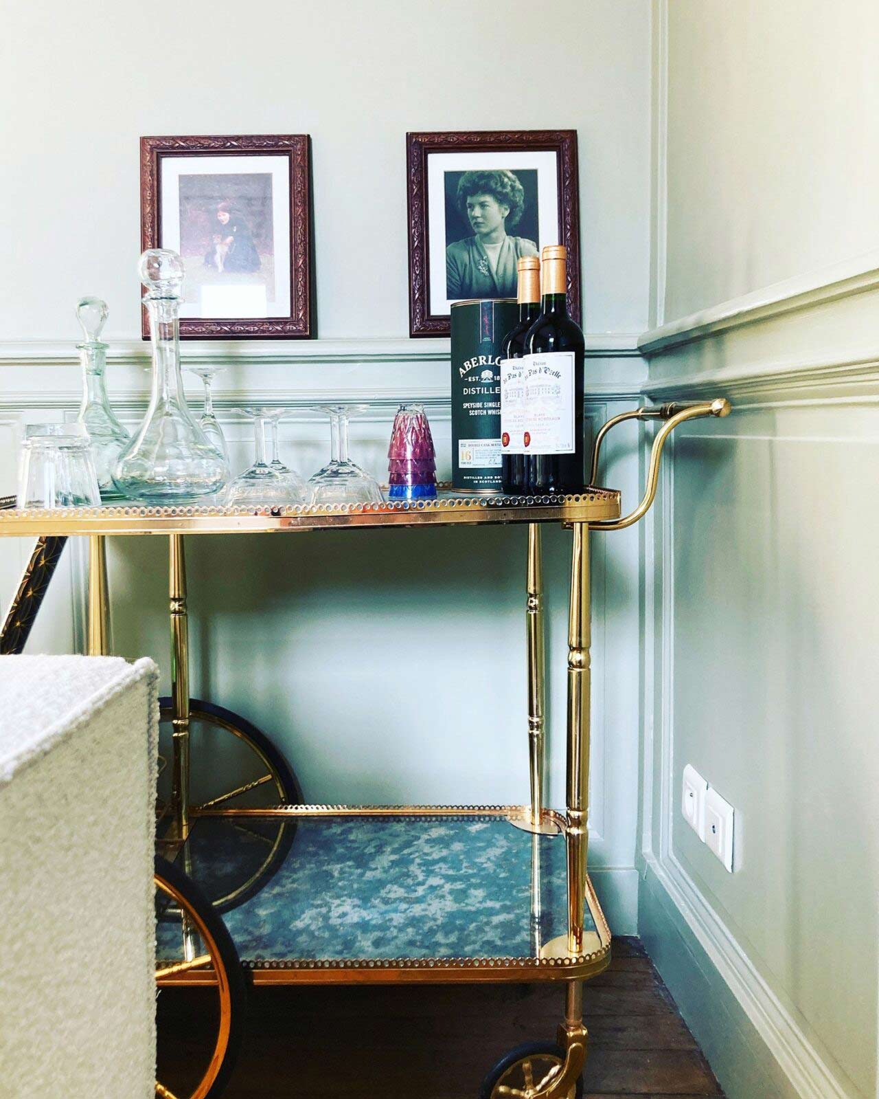 Gold plated, alcohol tray. With two pictures behind.