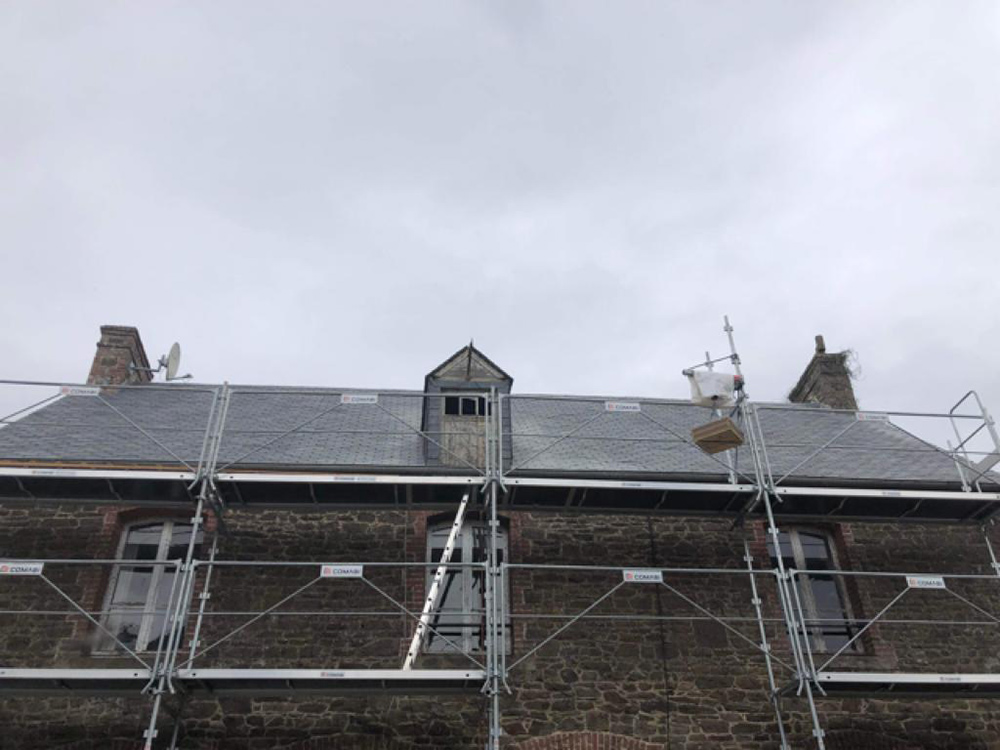 View of the front of the house with the new roof installed.