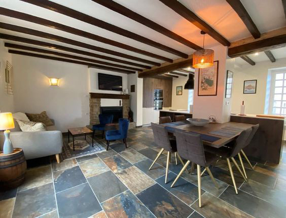 New of the dinnering room table, and of the sofa and armchairs.