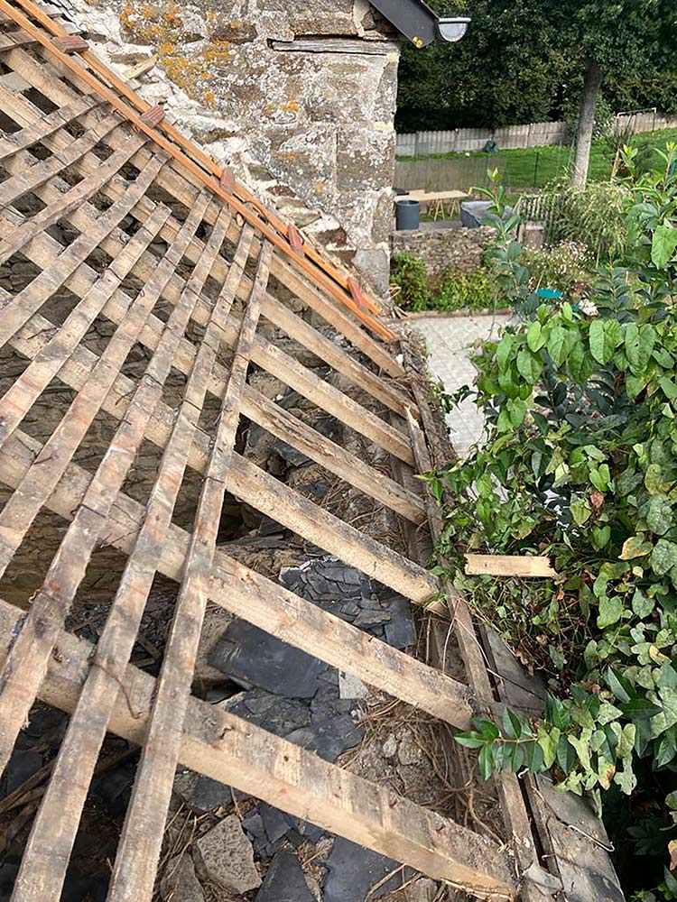 View of the wooden roof frame from the back of the property.